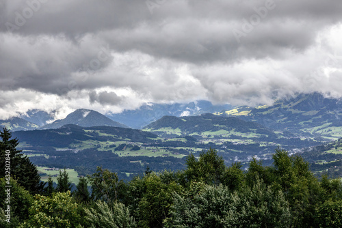 View at Bregenz and surrounding towns and mountains from mount Pf  nder  a local mountain in austria at a rainy day in summer
