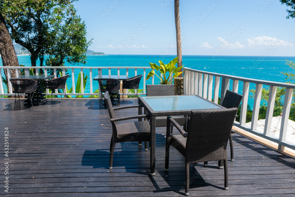 Empty table and chair with beach view