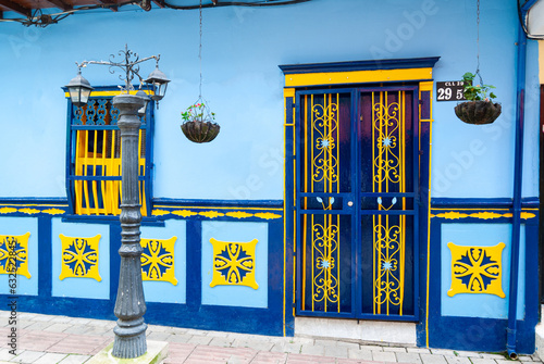 Artistic and colonial home in Latin America. Window and door vivid color.