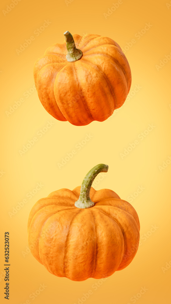 Fototapeta premium Ripe bright orange pumpkins placed on yellow surface
