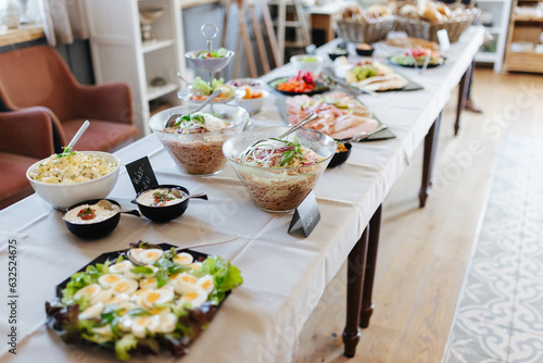 Buffet with salads  meats  and cheeses at a German wedding reception