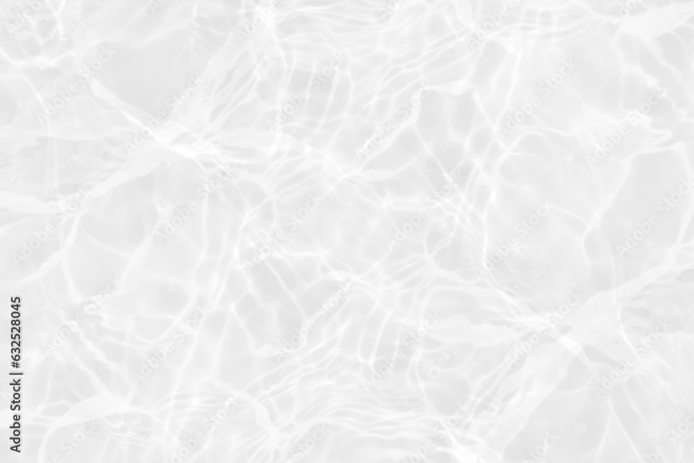 Obraz premium White water with ripples on the surface. Defocus blurred transparent white colored clear calm water surface texture with splashes and bubbles. Water waves with shining pattern texture background.