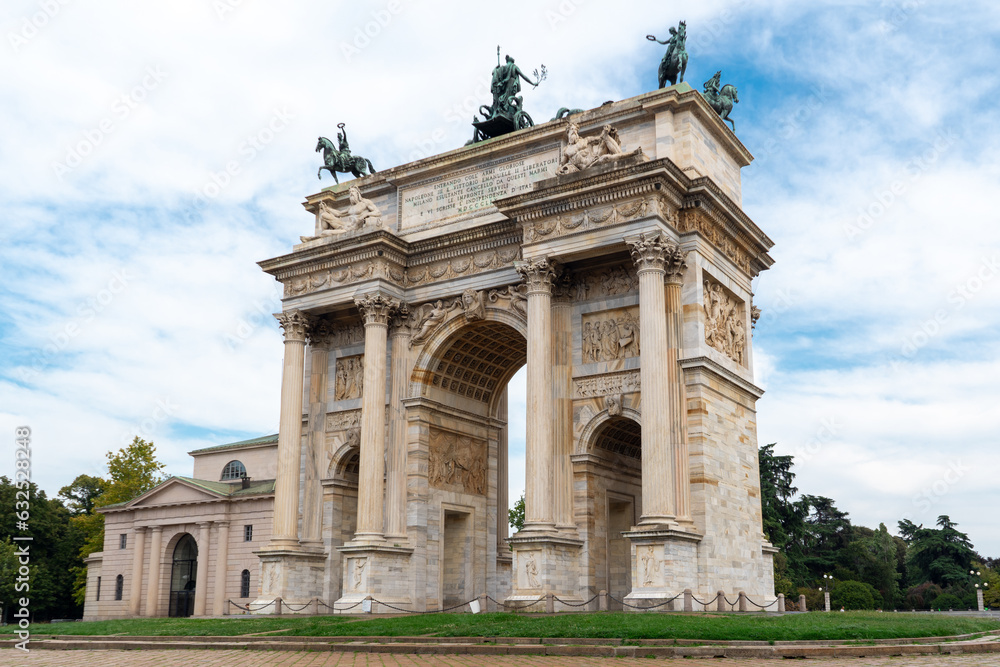 Arco della pace in Milan. The triumphal arch is covered by a green grass spot.
