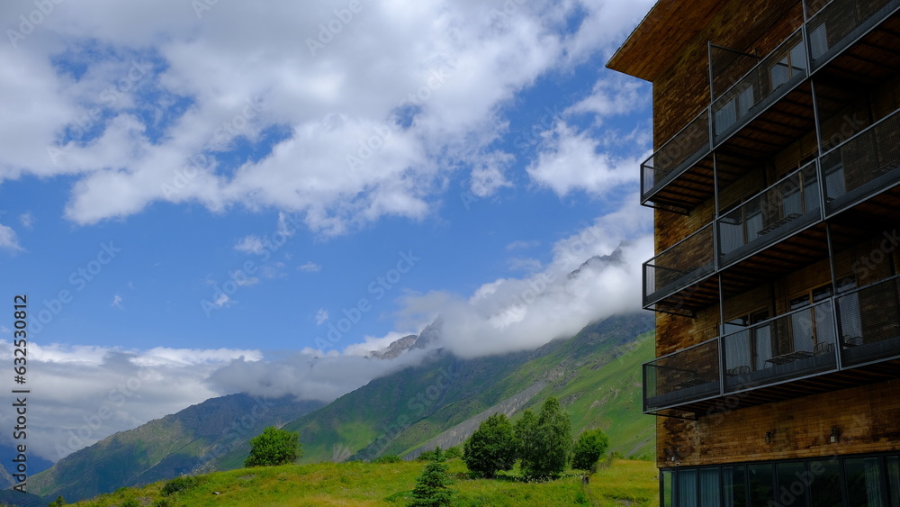 A View to Infinity: The Kazbegi Mountains Rise Above the Clouds, surrounding the small town of Kazbegi Mkinvartsveri in Georgia in a cloudy day in summer, Gudauri gergeti trinty church, ananuri A View to Infinity: The Kazbegi Mountains Rise Above the Clouds, surrounding the small town of Kazbegi Mkinvartsveri in Georgia in a cloudy day in summer, Gudauri gergeti trinty church, ananuri
