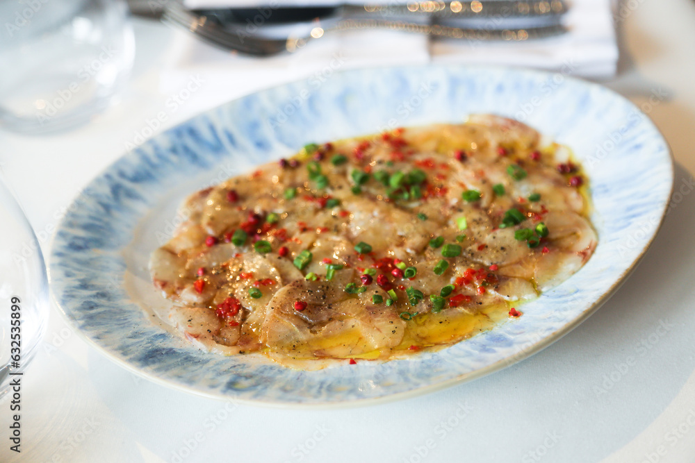 White fish appetizer with pepper and spring onion White fish appetizer with pepper and spring onion