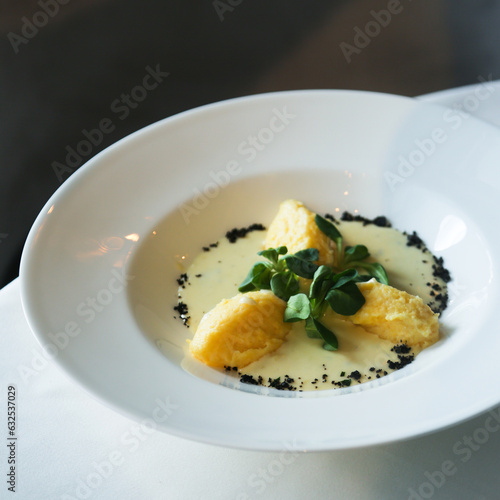 Traditional polenta served with spinach sauce