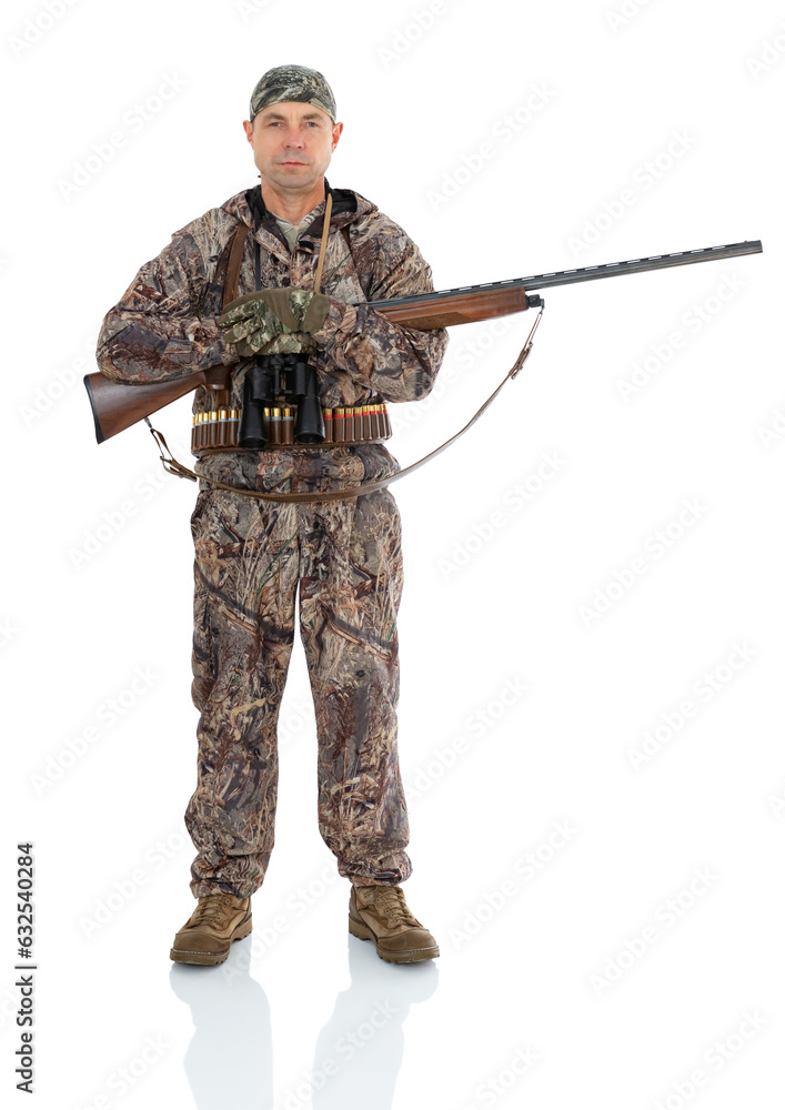 Full length portrait of duck hunter with a rifle on his shoulder and binoculars with folding arms isolated on white background. Fifty-year-old man in hunting uniform with a shotgun posing in studio Full length portrait of duck hunter with a rifle on his shoulder and binoculars with folding arms isolated on white background. Fifty-year-old man in hunting uniform with a shotgun posing in studio