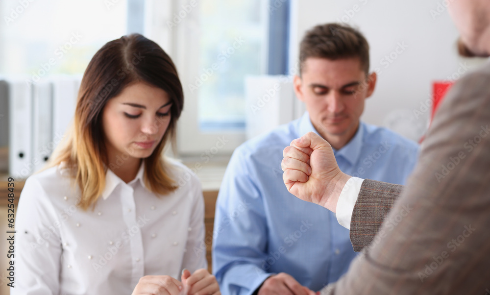 Businessman hand threatens his hired employees threatens staff with dismissal looking for guilty accuses of no fulfillment of tasks. Delay in action plan at the enterprise participants fists finger.