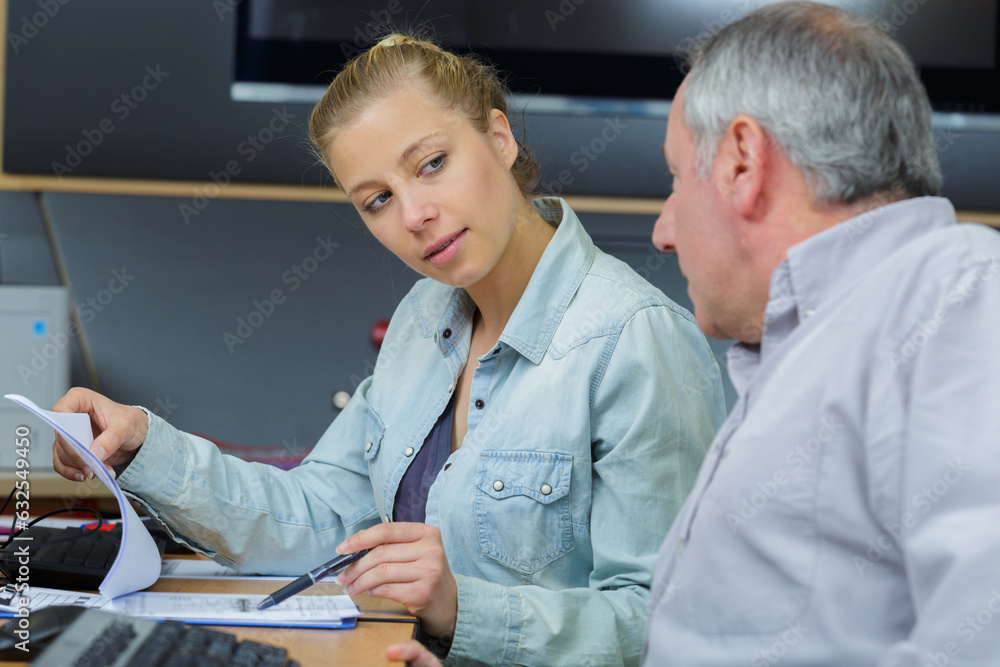 Obraz premium man and woman workers in workshop