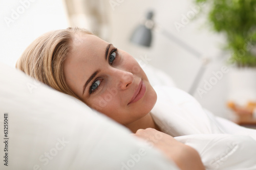 Young beautiful woman waking up in the morning concept