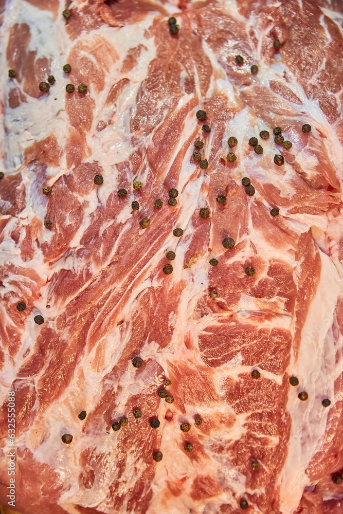 Fototapeta premium A piece of raw meat, close-up. Raw food for cooking.