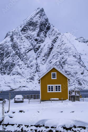 Yellow cabin with a view of snowy mountain