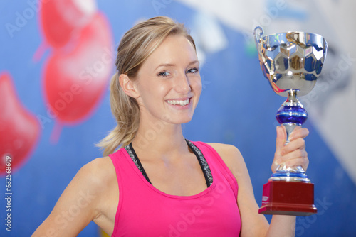 Fotografie happy woman holding a trophy