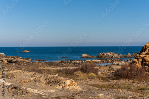 Cap de Creus Alt Emporda, Spain. February 2023 Rugged rocky coastline with turquoise waters in contrast. Sharp rocks extend out to the sea, creating a dramatic and wild texture.