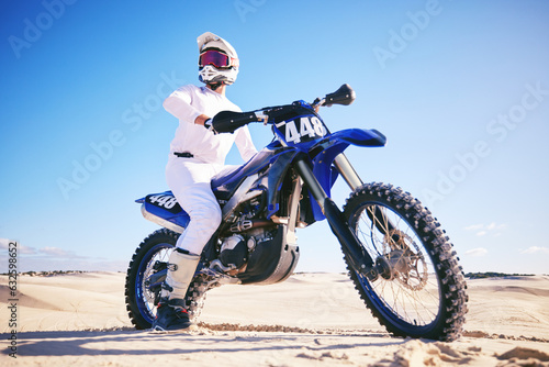 Fototapeta Naklejka Na Ścianę i Meble -  Sand, motor sports and man drive with motorbike for adrenaline, adventure and freedom in desert. Action, extreme sport and male person on bike on dunes for training, exercise and race or challenge