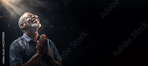 An elderly man of African ethnicity praying. Christian religious prayer and devotion banner with copy space. Generative AI illustration