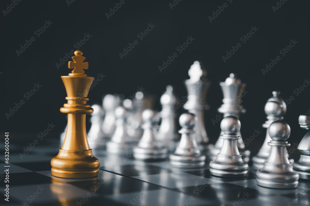 King golden chess standing confront of the silver chess team.chess board game concept of business ideas and competition and stratagy plan success meaning King golden chess standing confront of the silver chess team.chess board game concept of business ideas and competition and stratagy plan success meaning