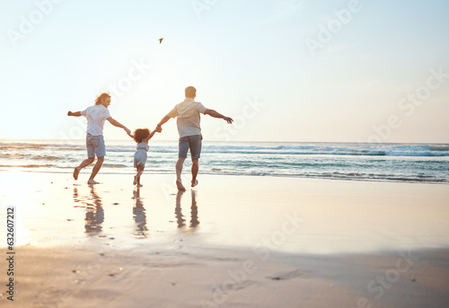 Gay parents holding hands with girl at beach running in water on holiday, vacation and adventure. Lgbtq family, sunset and happy child with fathers by ocean for bonding, relaxing and fun outdoors