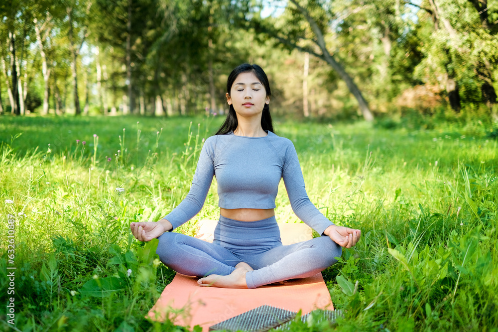 Young attractive asian woman practicing yoga Young attractive asian woman practicing yoga