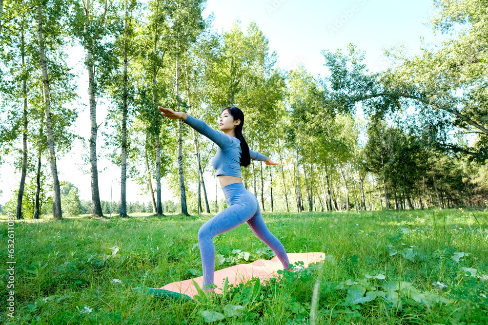 Portrait of a young woman doing yoga in the garden for a workout. Concept of lifestyle fitness and healthy. Asian women are practicing yoga in the park. Portrait of a young woman doing yoga in the garden for a workout. Concept of lifestyle fitness and healthy. Asian women are practicing yoga in the park.