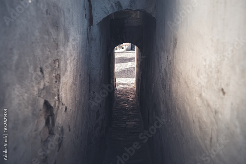 Old narrow arched corridor between buildings in old town of Szentendre, Hungary