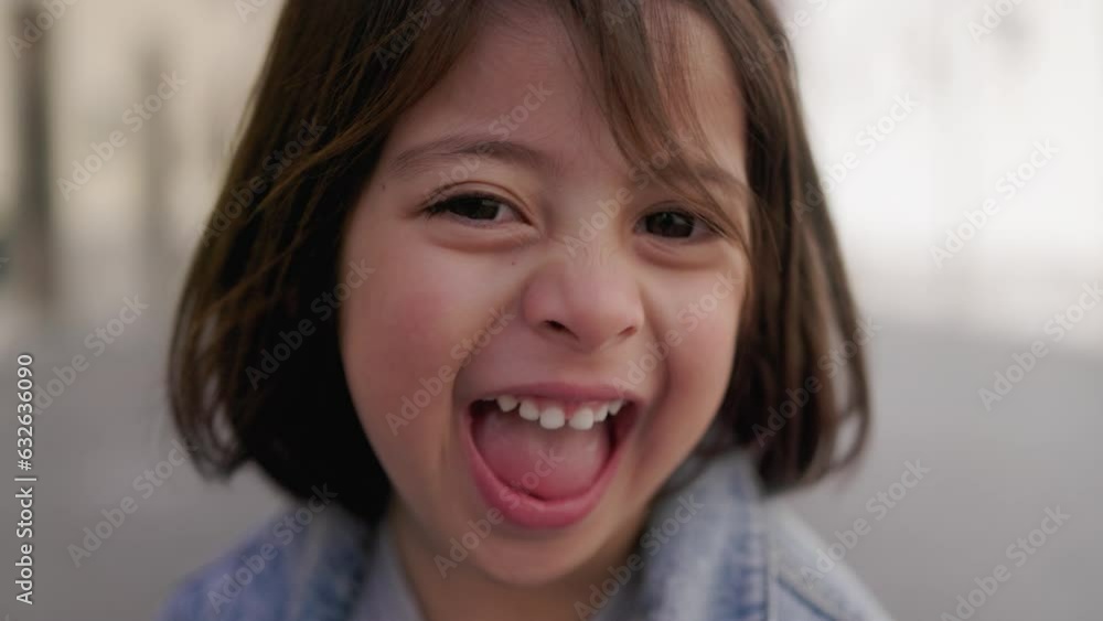 Asian girl child having fun laughing on camera outside - Joyful moments Asian girl child having fun laughing on camera outside - Joyful moments