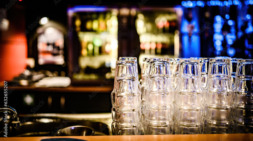 Stylish night bar counter with glasses in modern night pub or nightclub