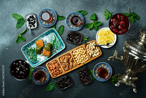 Tea ceremony. Azerbaijani traditional serving of tea. Tea, dried fruits and nuts. Top view. photo