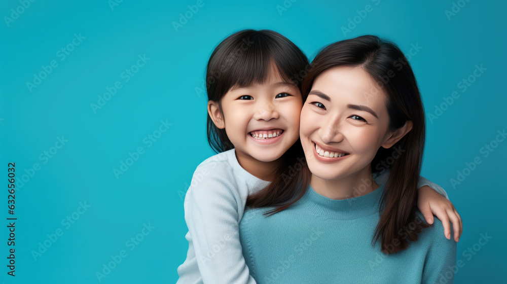 Happy mother and daughter smiling and hugging against the blue background. Created with Generative AI technology. Happy mother and daughter smiling and hugging against the blue background. Created with Generative AI technology.