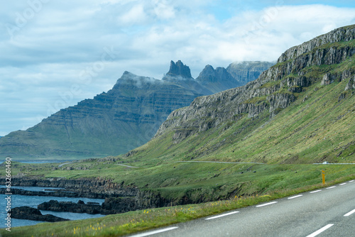 The famous ring road as it twists and turns through the scenic eastern fjords of Iceland during summer, with towering mountains