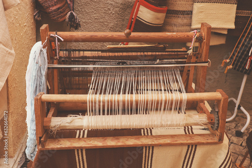 A closeup image of an old weaving Loom in a street market photo