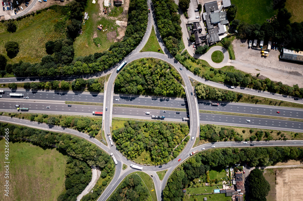 Aerial view directly above an overbridge roundabout motorway junction Aerial view directly above an overbridge roundabout motorway junction