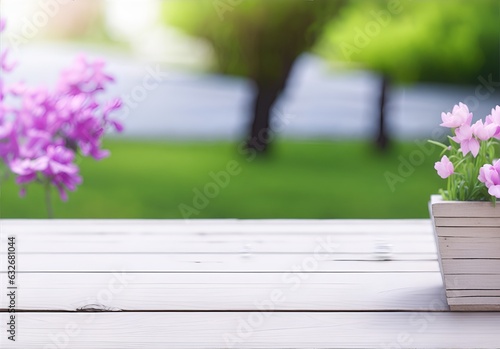 flowers on wooden table with blurred garden background