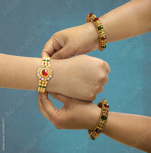 raksha Bandhan A sister is binding rakhi on her brother s hand on the occasion of raksha Bandhan photo