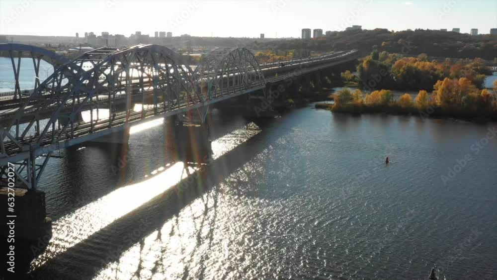 Aerial drone video of a bridge. Modern automobile and old railway bridges in Kiev. Kyiv, Ukraine. Dramatic colorful sunset over Dnipro river. Historical sights of Ukraine. Beautiful scenic view Aerial drone video of a bridge. Modern automobile and old railway bridges in Kiev. Kyiv, Ukraine. Dramatic colorful sunset over Dnipro river. Historical sights of Ukraine. Beautiful scenic view