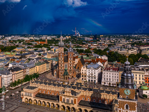The old town of Krakow in Poland, with a storm and a rainbow in the background.