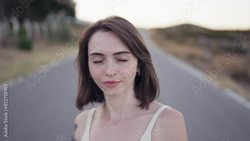 Close-up portrait of nice-looking multi-race beautiful elegant young white woman looking into camera. Daily people life, fashion, beauty. Female portraits. Beautiful green hazel eyes. Cool model girl.