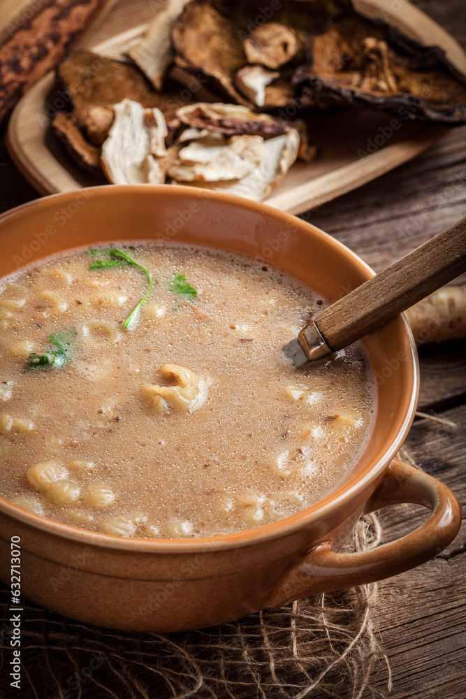 Mushroom soup on a wooden table.