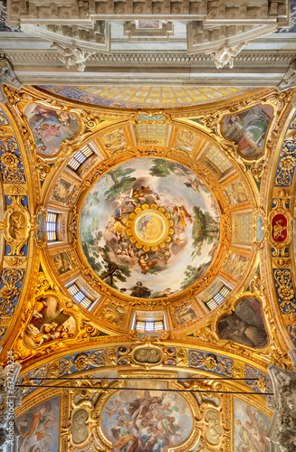 GENOVA, ITALY - MARCH 6, 2023: The frescoes on the side cupola in church Basilica della Santissima Annunziata del Vastato probably by Giulio Benso from 18. cent..