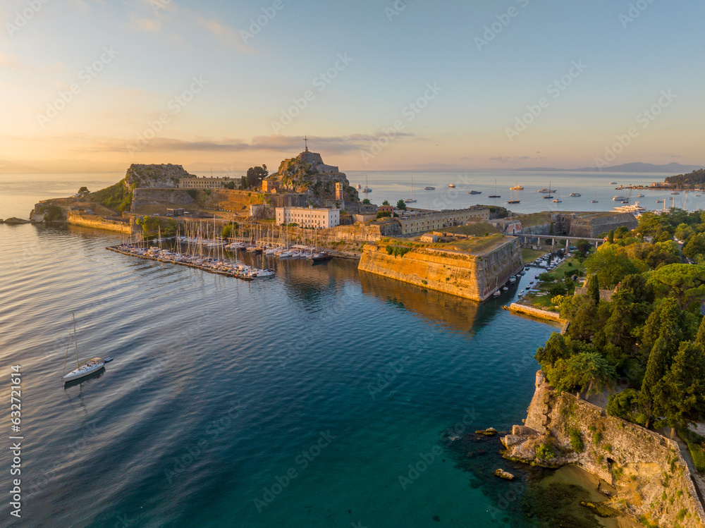 Cityscape with famous touristic landmark Old Venetian Fortress with walls going to sea. Kerkyra city, Corfu, Greece