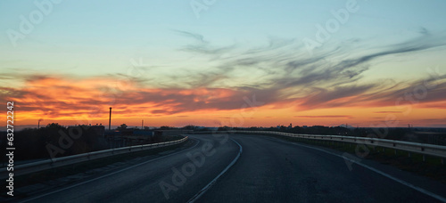 Beautiful sunset on the highway between the cities. Landscape with nature and clouds © Fotoproff