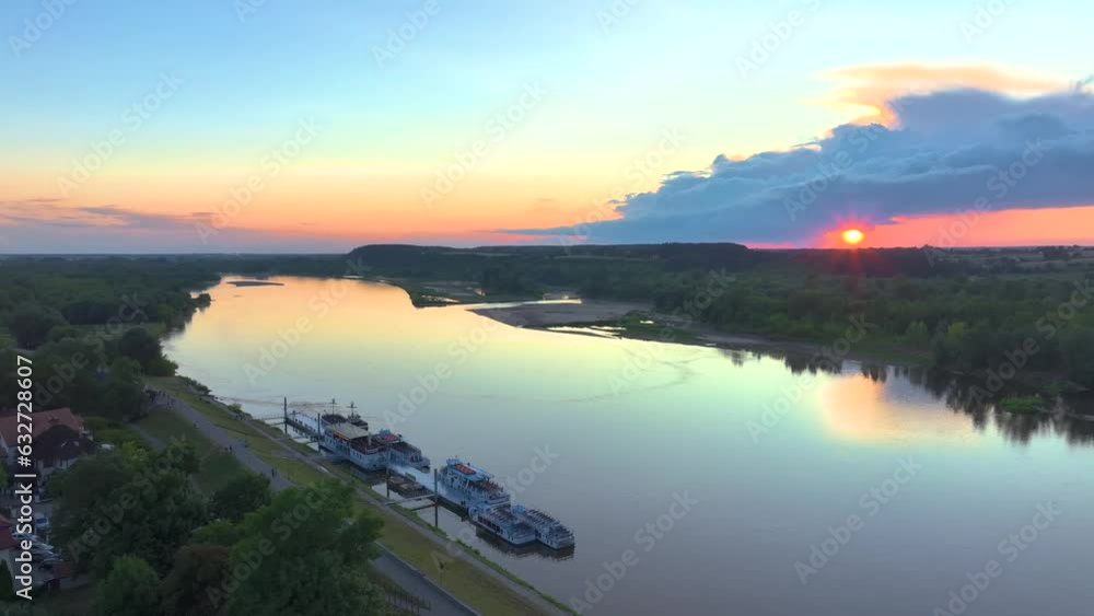 The lazy and calm Vistula flowing through Kazimierz Dolny on a beautiful summer day. The lazy and calm Vistula flowing through Kazimierz Dolny on a beautiful summer day.