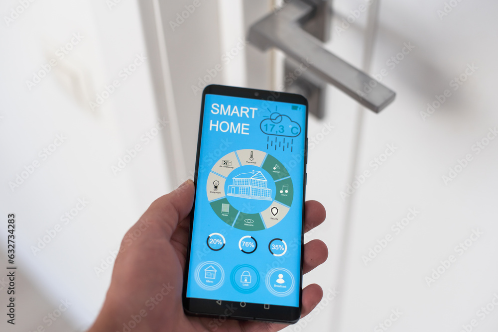 smart house, home automation, device with app icons. Man uses his smartphone with smarthome security app to unlock the door of his house. smart house, home automation, device with app icons. Man uses his smartphone with smarthome security app to unlock the door of his house.