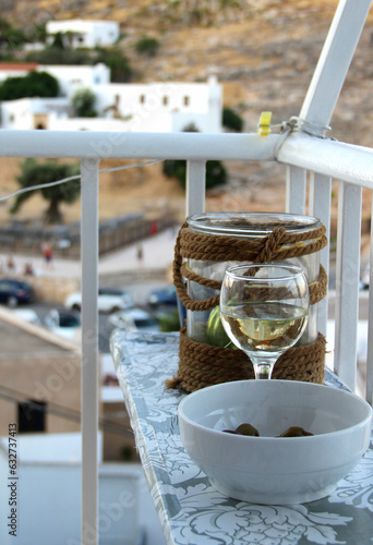 Glass of wine and Greek white houses © Tanouchka
