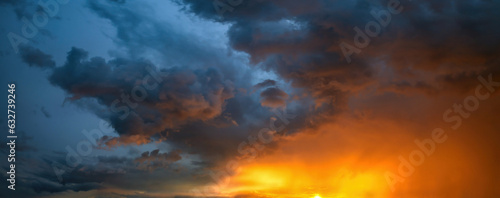 Nice evening stormy dramatic sunset sky with colorful clouds, nature and backgrounds