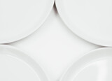White round plate on white background copy space