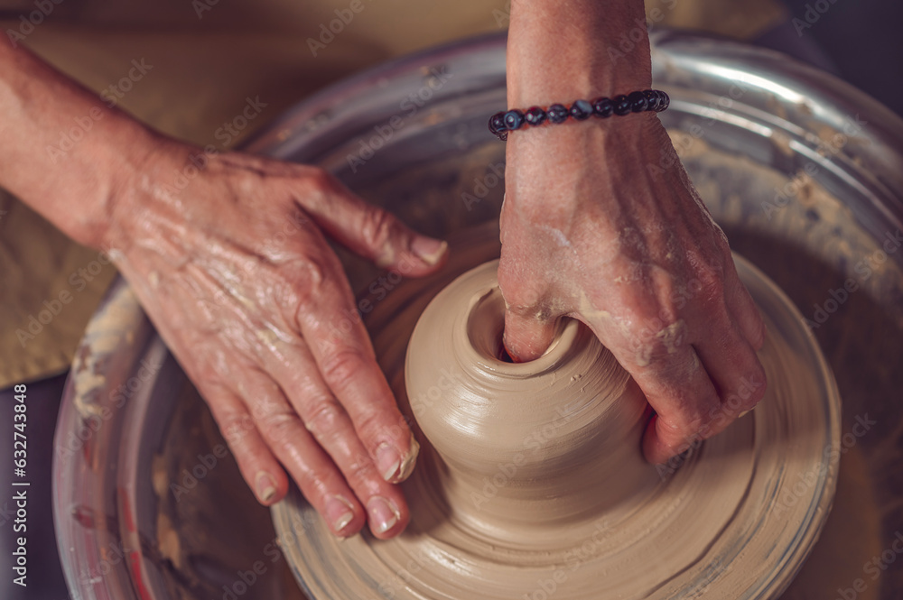Ceramic bowl on a potter's wheel, ceramist's hands. Ceramic bowl on a potter's wheel, ceramist's hands.