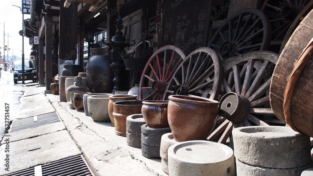 Traditional Japanese pottery and wooden wheels in display in Takayama Japan