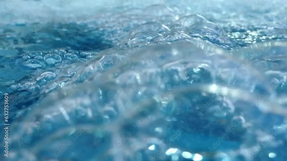 Video of pool water with cascading waterfall bubbles, a refreshing retreat Video of pool water with cascading waterfall bubbles, a refreshing retreat