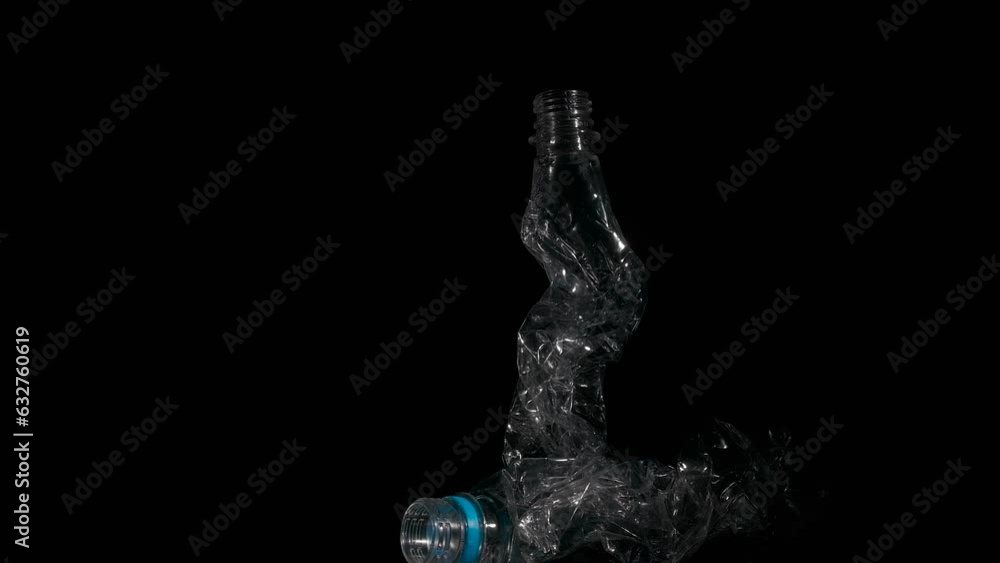 Two plastic bottles for recycling on black. A view of two plastic bottles on the black background. A concept of problems with recycling plastic and health damage. Two plastic bottles for recycling on black. A view of two plastic bottles on the black background. A concept of problems with recycling plastic and health damage.